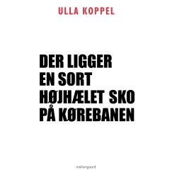 DER LIGGER EN SORT H�JH�LET SKO P� K�REBANEN